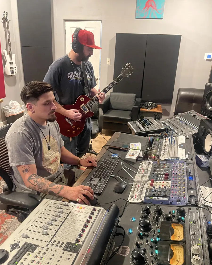 Matt Poole Butler tracking guitar with an artist in Studio A at EMP Studios